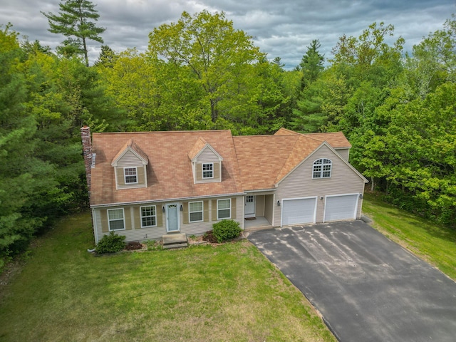 17 Easy St, Standish, ME 04084 - cape cod house featuring asphalt driveway, a front lawn, a chimney, and an attached garage