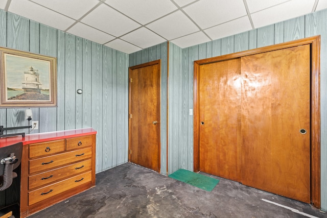 4 Shirley Ln, Gorham, ME 04038 - interior space featuring a drop ceiling, wooden walls, and concrete flooring