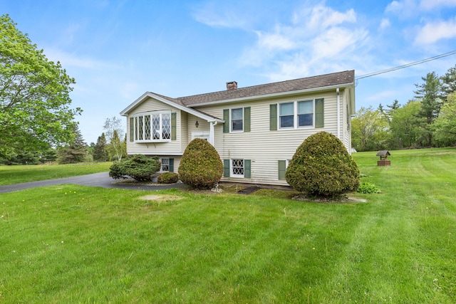 4 Shirley Ln, Gorham, ME 04038 - raised ranch with a chimney and a front lawn