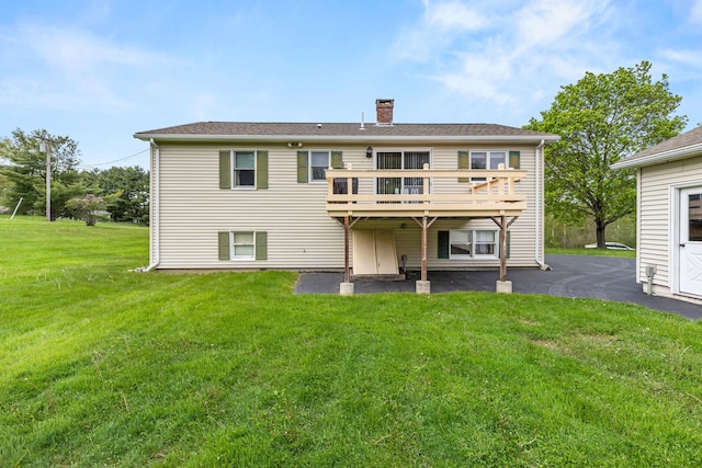 4 Shirley Ln, Gorham, ME 04038 - rear view of property featuring a chimney, a wooden deck, and a lawn