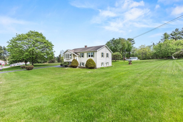 4 Shirley Ln, Gorham, ME 04038 - view of front of home with a front yard and a chimney