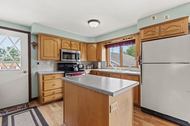 4 Shirley Ln, Gorham, ME 04038 - kitchen with freestanding refrigerator, range with electric cooktop, a sink, stainless steel microwave, and healthy amount of natural light