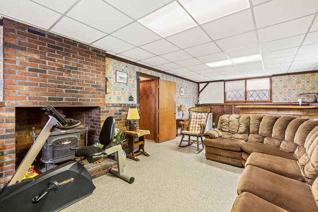 4 Shirley Ln, Gorham, ME 04038 - living room with a wood stove, a drop ceiling, wallpapered walls, and carpet