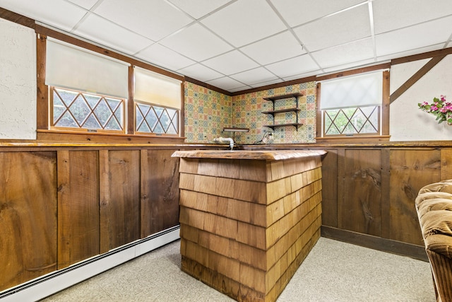 4 Shirley Ln, Gorham, ME 04038 - indoor bar with a baseboard radiator, a drop ceiling, wooden walls, and a wainscoted wall