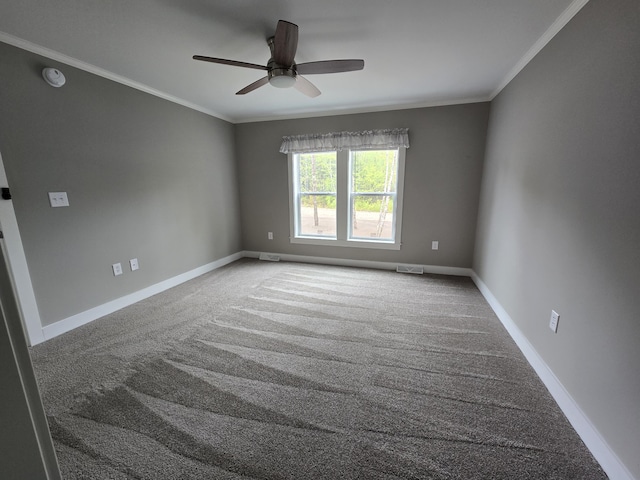 209 Sandy Acres Dr, Sullivan, ME 04664 - empty room with carpet, ornamental molding, ceiling fan, baseboards, and a smoke detector