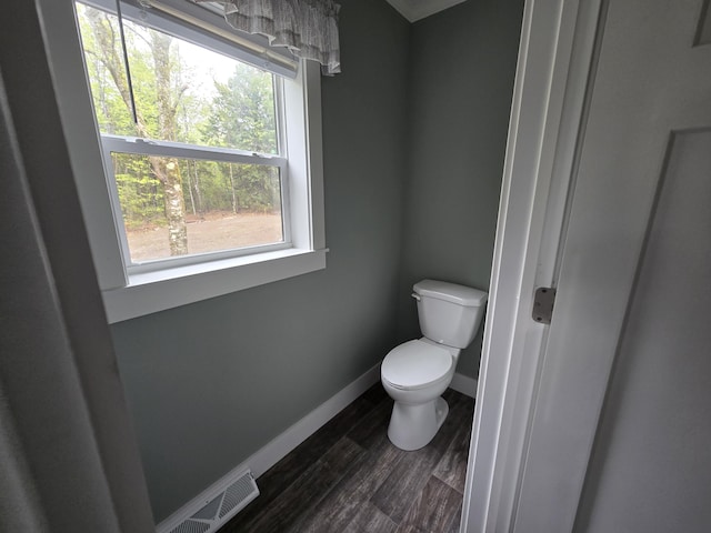 209 Sandy Acres Dr, Sullivan, ME 04664 - bathroom with toilet, wood finished floors, and baseboards