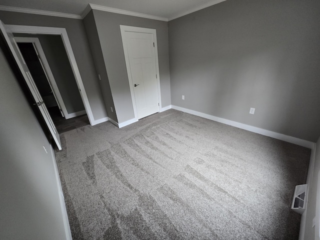 209 Sandy Acres Dr, Sullivan, ME 04664 - unfurnished bedroom with baseboards, crown molding, and carpet flooring