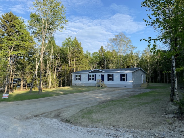 209 Sandy Acres Dr, Sullivan, ME 04664 - manufactured / mobile home featuring crawl space, driveway, and a forest view