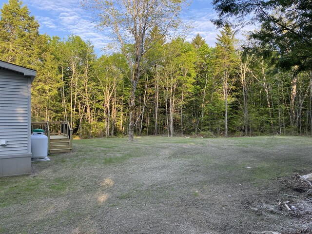 209 Sandy Acres Dr, Sullivan, ME 04664 - view of yard with a deck and a forest view