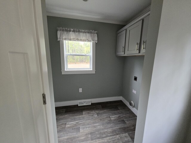 209 Sandy Acres Dr, Sullivan, ME 04664 - laundry area with hookup for an electric dryer, dark wood-type flooring, and cabinet space