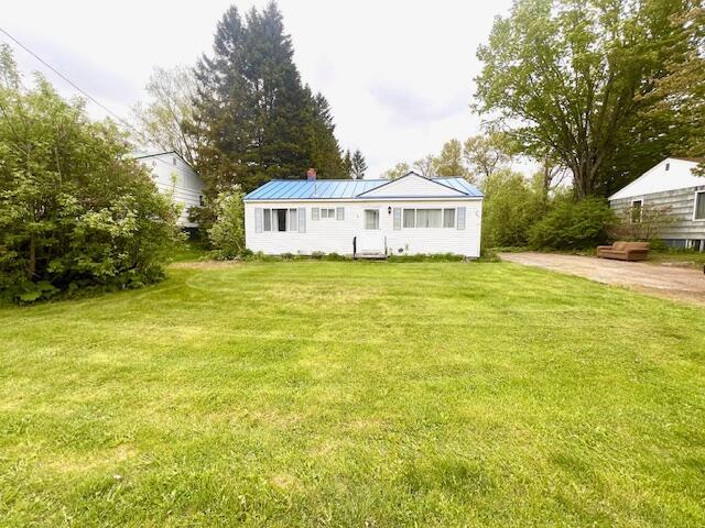 16 Pearce Ave, Houlton, ME 04730 - view of front of property with a front yard and a chimney