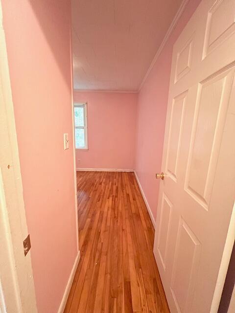 16 Pearce Ave, Houlton, ME 04730 - hallway with crown molding, baseboards, and light wood-style floors