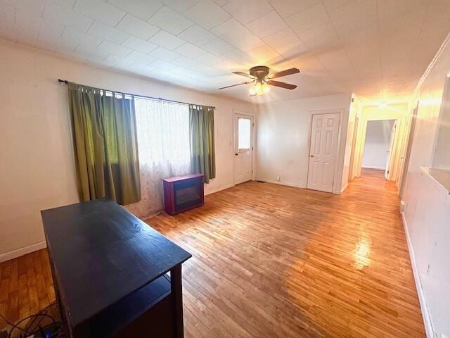 16 Pearce Ave, Houlton, ME 04730 - living room featuring ceiling fan, light wood-style floors, and baseboards
