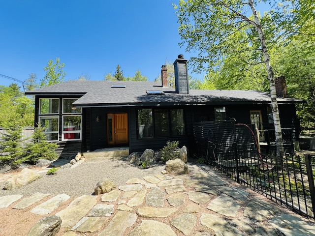 341 Ellsworth Rd, Blue Hill, ME 04614 - back of property featuring a chimney and roof with shingles