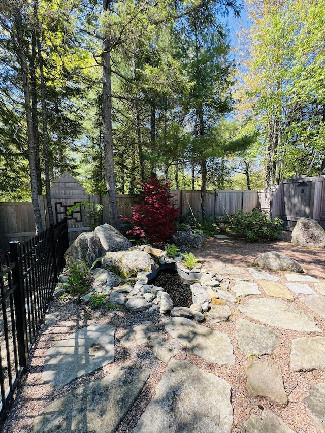 341 Ellsworth Rd, Blue Hill, ME 04614 - fenced backyard with a patio