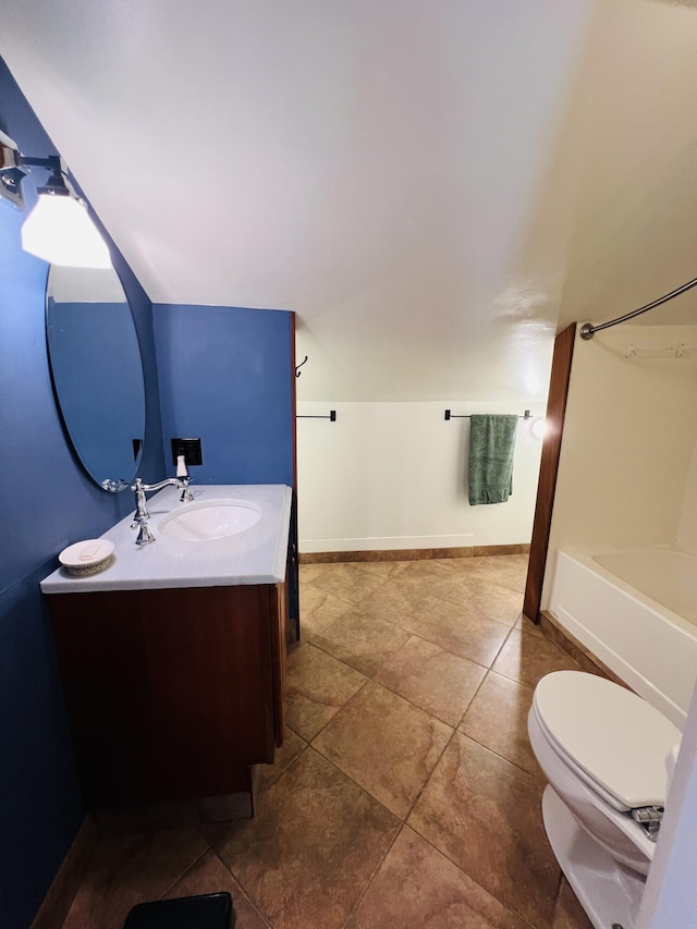 341 Ellsworth Rd, Blue Hill, ME 04614 - bathroom with vanity, toilet, baseboards, tile patterned floors, and lofted ceiling
