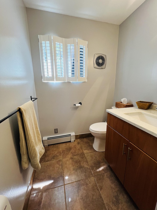 341 Ellsworth Rd, Blue Hill, ME 04614 - bathroom with baseboard heating, vanity, and toilet