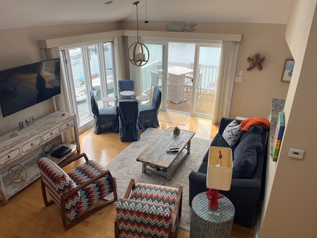 47 Ocean Ave Unit 6, Kennebunkport, ME 04046 - living room with wood finished floors and a chandelier