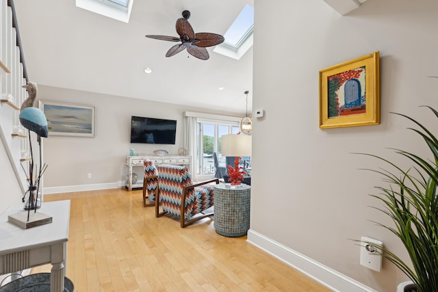 47 Ocean Ave Unit 6, Kennebunkport, ME 04046 - living room featuring a skylight, vaulted ceiling, light wood-type flooring, a ceiling fan, and recessed lighting