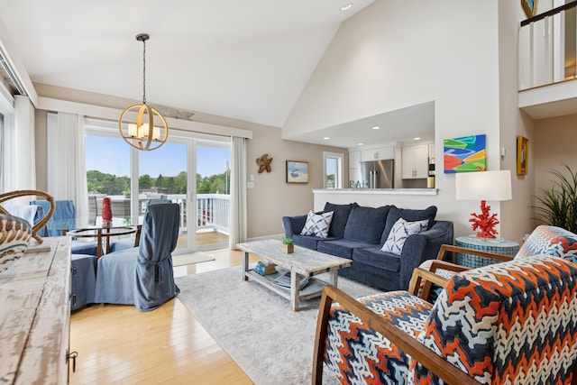 47 Ocean Ave Unit 6, Kennebunkport, ME 04046 - living room featuring high vaulted ceiling, a chandelier, light wood-style flooring, and recessed lighting