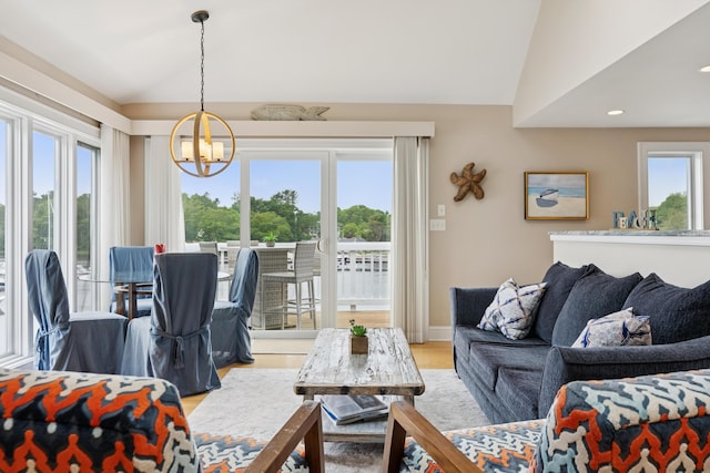 47 Ocean Ave Unit 6, Kennebunkport, ME 04046 - living room featuring lofted ceiling, a chandelier, light wood-style floors, and recessed lighting