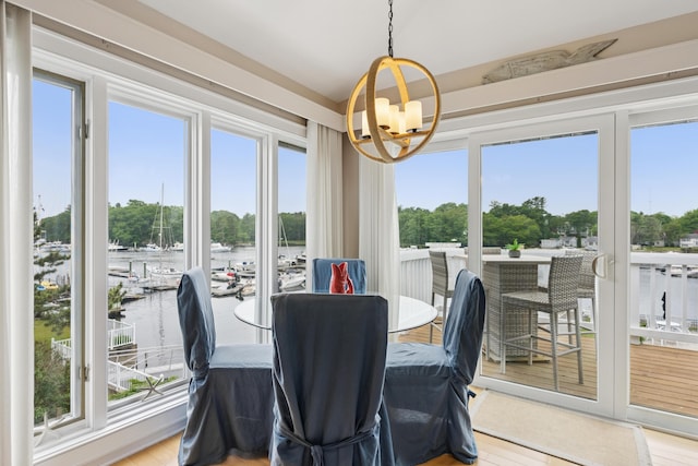 47 Ocean Ave Unit 6, Kennebunkport, ME 04046 - dining space with a chandelier and a water view