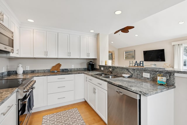 47 Ocean Ave Unit 6, Kennebunkport, ME 04046 - kitchen with stainless steel appliances, a ceiling fan, light wood-style flooring, white cabinets, and recessed lighting