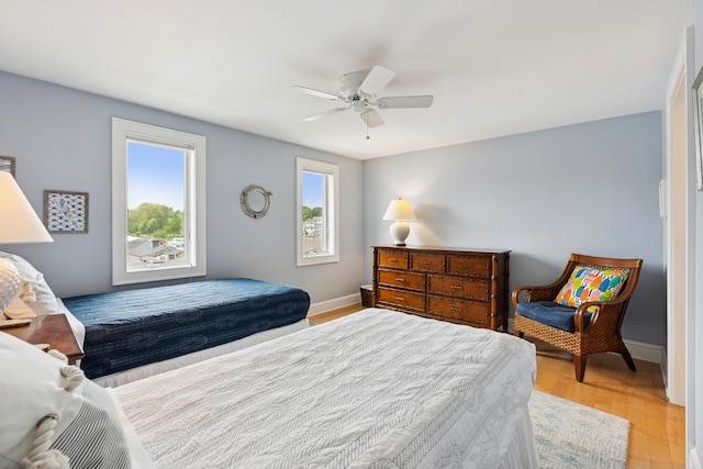47 Ocean Ave Unit 6, Kennebunkport, ME 04046 - bedroom with light wood-style flooring and a ceiling fan