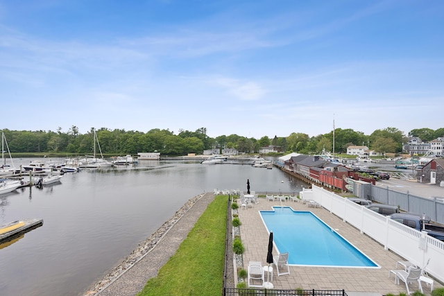 47 Ocean Ave Unit 6, Kennebunkport, ME 04046 - community pool with a fenced backyard, a water view, a patio, and view of wooded area