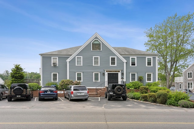 47 Ocean Ave Unit 6, Kennebunkport, ME 04046 - view of front facade featuring uncovered parking and roof with shingles