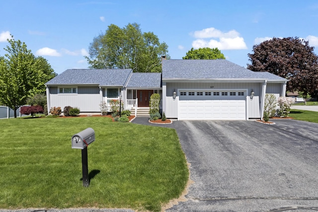 37 Longbow Ct, Auburn, ME 04210 - ranch-style house featuring an attached garage, a front yard, driveway, and roof with shingles