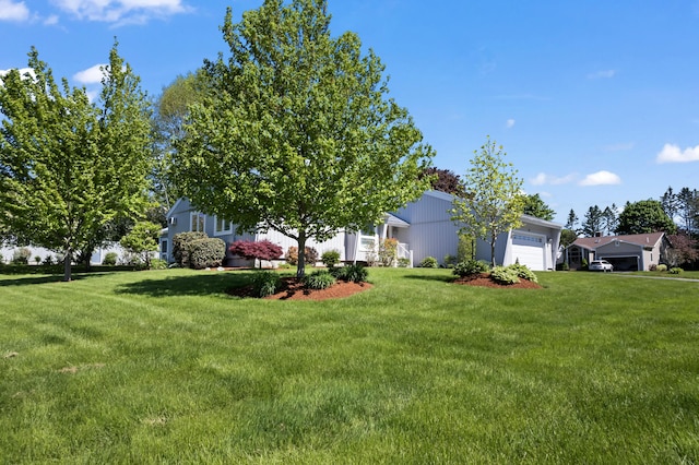 37 Longbow Ct, Auburn, ME 04210 - view of green lawn featuring an attached garage