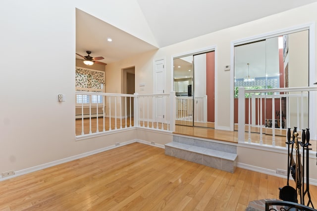 37 Longbow Ct, Auburn, ME 04210 - spare room featuring ceiling fan, hardwood / wood-style flooring, lofted ceiling, baseboards, and a baseboard heating unit