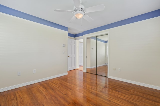 37 Longbow Ct, Auburn, ME 04210 - unfurnished bedroom featuring wood finished floors, baseboards, a closet, and a ceiling fan
