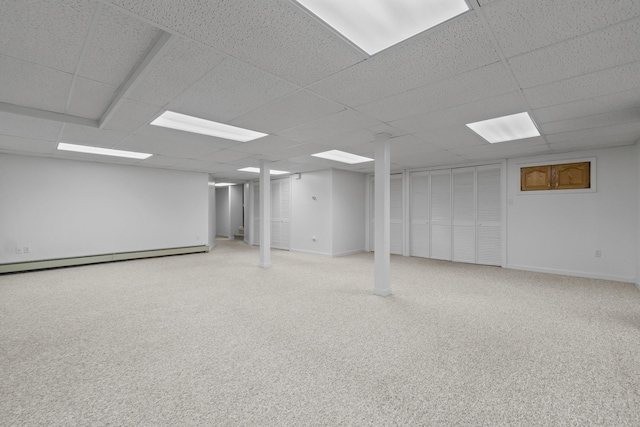 37 Longbow Ct, Auburn, ME 04210 - finished basement with a paneled ceiling, a baseboard heating unit, carpet flooring, and baseboards