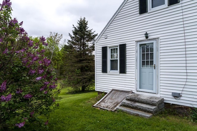 57 Bow St, Freeport, ME 04032 - doorway to property featuring a yard