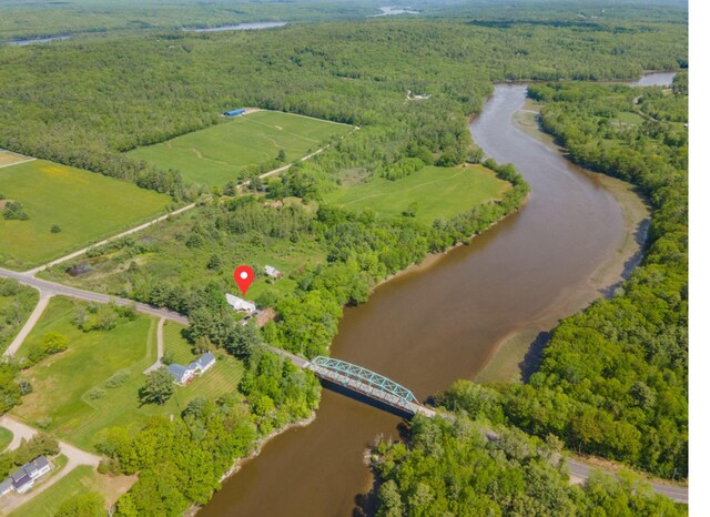 79 Patterson Rd, Dresden, ME 04342 - aerial view of a large body of water and a heavily wooded area
