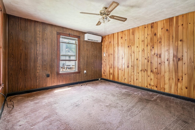 27 Maple St, Limerick, ME 04048 - carpeted empty room with a ceiling fan, a wall unit AC, baseboards, and wood walls