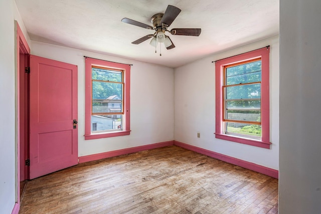 27 Maple St, Limerick, ME 04048 - spare room with plenty of natural light, hardwood / wood-style flooring, baseboards, and a ceiling fan