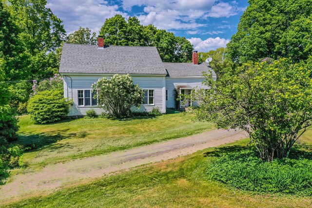 176 Bagley Hill Rd, Troy, ME 04987 - view of front of house featuring a chimney and a front lawn