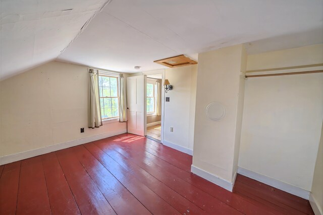 176 Bagley Hill Rd, Troy, ME 04987 - unfurnished bedroom with wood-type flooring, baseboards, and vaulted ceiling