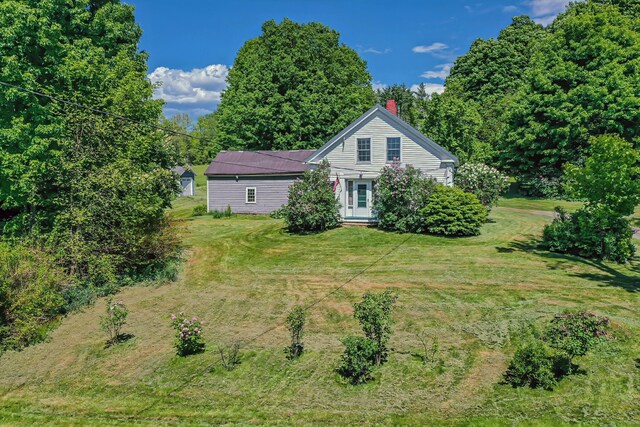 176 Bagley Hill Rd, Troy, ME 04987 - view of front facade featuring a chimney and a front lawn