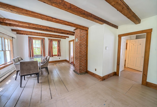 176 Bagley Hill Rd, Troy, ME 04987 - dining room with baseboards, light wood-style floors, and beam ceiling