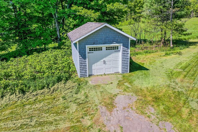 176 Bagley Hill Rd, Troy, ME 04987 - detached garage with driveway and a wooded view