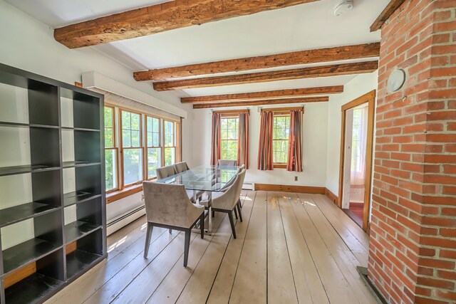 176 Bagley Hill Rd, Troy, ME 04987 - dining area featuring a baseboard radiator, plenty of natural light, baseboards, light wood finished floors, and beamed ceiling