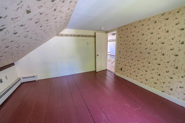 176 Bagley Hill Rd, Troy, ME 04987 - additional living space with dark wood-style flooring, baseboards, wallpapered walls, and lofted ceiling