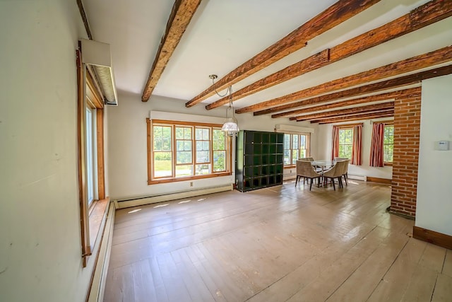 176 Bagley Hill Rd, Troy, ME 04987 - living area featuring a baseboard heating unit, beamed ceiling, wood-type flooring, and baseboards