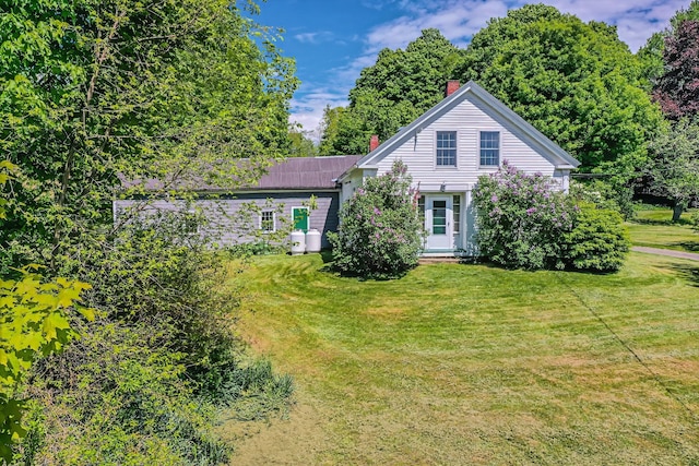 176 Bagley Hill Rd, Troy, ME 04987 - view of front of home featuring a chimney and a front lawn