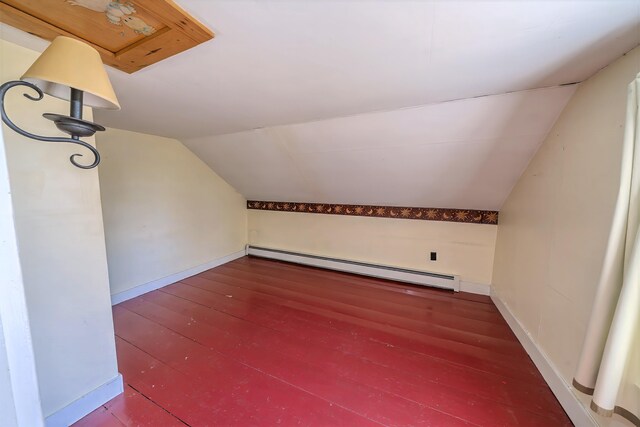 176 Bagley Hill Rd, Troy, ME 04987 - bonus room with a baseboard radiator, lofted ceiling, hardwood / wood-style flooring, and baseboards