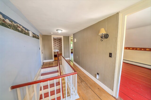 176 Bagley Hill Rd, Troy, ME 04987 - hall featuring a baseboard radiator, light wood-type flooring, and an upstairs landing